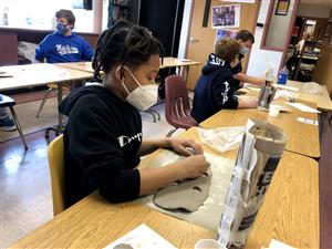 Students working on sculpture projects
