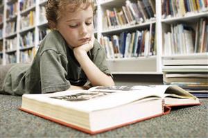 Boy reading a book 