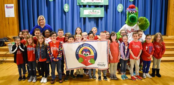 Phillie Phanatic poses with a class at Walter Miller Elementary School