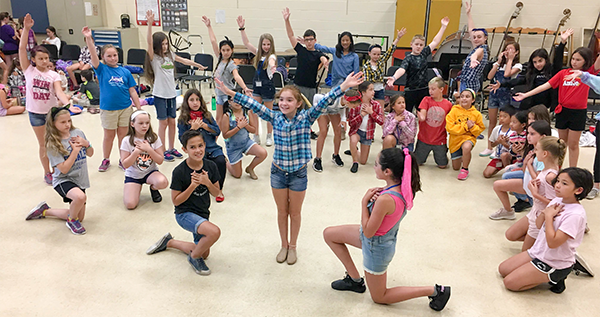 Cast of Annie Junior rehearses