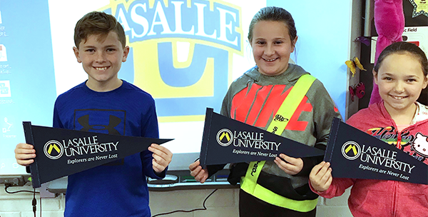 Ferderbar students hold up LaSalle College flags