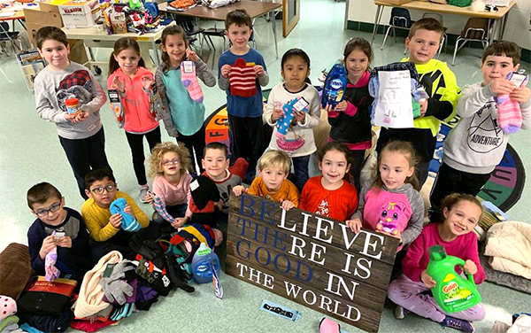 Buck first-grade class with kindness sign