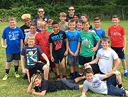 Police officers pose with students
