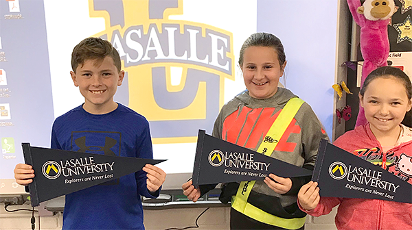 Students holding LaSalle penants