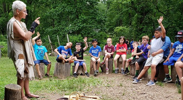 Third grade students listen to a guide at the Churchville Nature Center