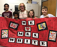 Hoover students with nurse and poster