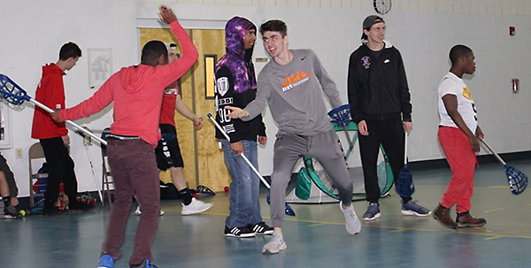 Lacrosse team visits Woods students