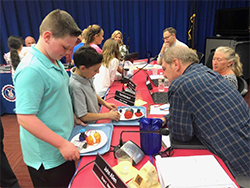 Students show their projects to Board members