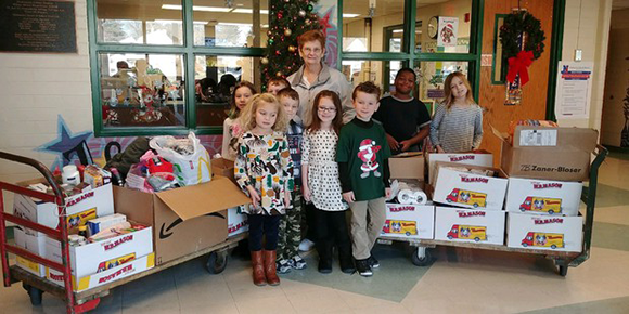 Students with food donations at Walter Miller Elementary