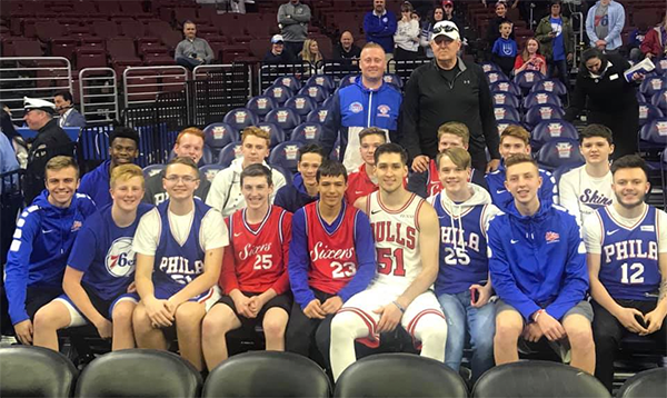 Ryan Arcidiacono with Neshaminy students at a Sixers game