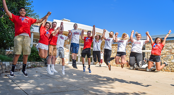 Neshaminy HS students jumping in front of the school
