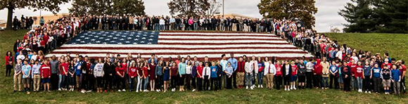 Maple Point students pose with veterans outside the school