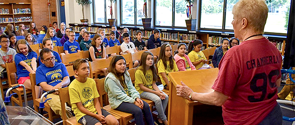 Rotary Club President speaks to students in the Poquessing library