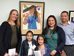 Schweitzer ES artist with her teacher and family