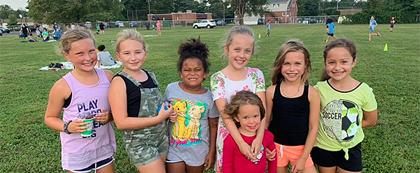 Students enjoy the CARES picnic outside Schweitzer Elementary