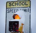 School sign in the snow