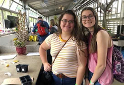 Students in a greenhouse at the STEAMM Day