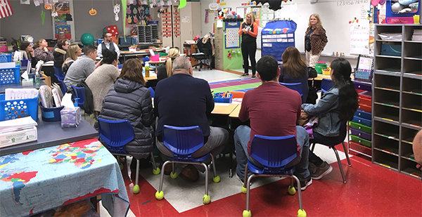 Parents attending a kindergarten presentation