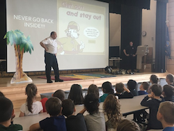 Firefighter speaking to students at Tawanka Elementary