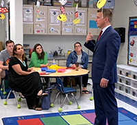 Principal Donald Palmer speaks to parents